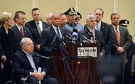 Massachusetts Governor Deval Patrick (C, at podium) gives a press conference, April 16, 2013 in Boston, Massachusetts